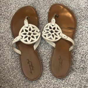 White and tan American eagle slides flip-flops